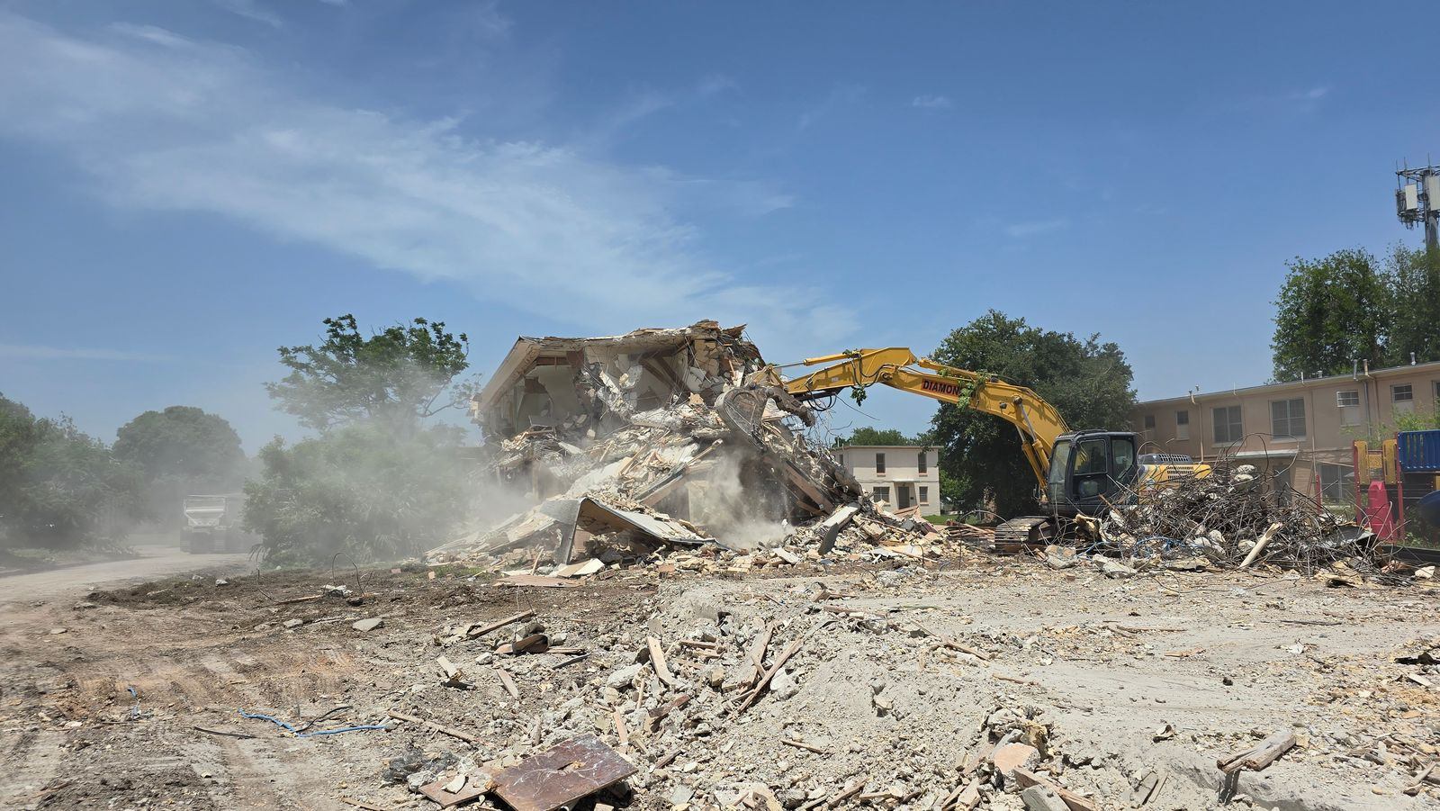 Diamond Eight excavator — structure demolition, South Texas