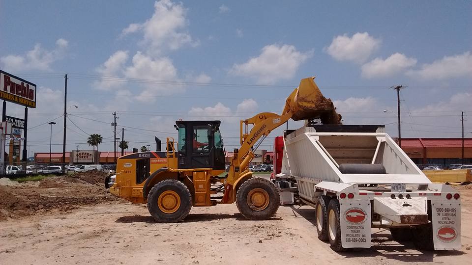 Diamond 8 LiuGong loader loading dump truck — commercial site prep